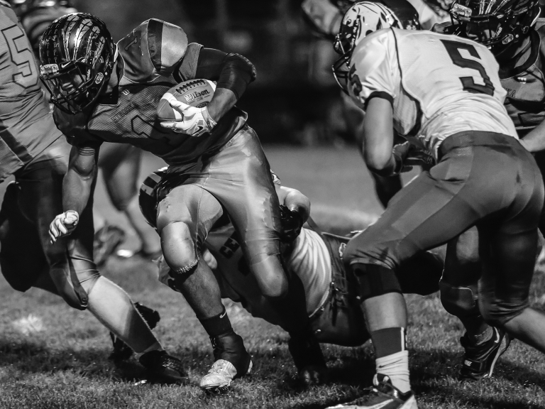 Nate Gunn, MCHS Class of 2015, rushes the ball for the Indians in this 2014 photo.  He now plays at South Dakota University.