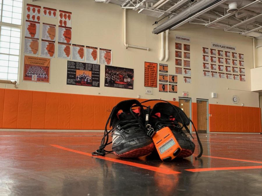 Rudy leaves his shoes on the mat after his final practice at MCHS.