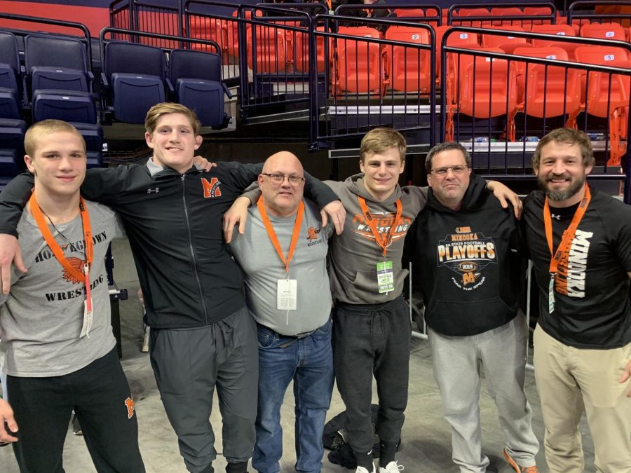 Junior Jack McClimon, senior Drew Gutknecht, head coach Bernie Ruettiger, senior Jake Mensik, assistant coach Jeff Charlebois, and assistant coach Mike Kimberlin get together at the 2020 IHSA Individual State Wrestling Finals.  Ruettiger is retiring after 21 years at Minooka. His lifetime record as a head wrestling coach for 30 years is 517-167.