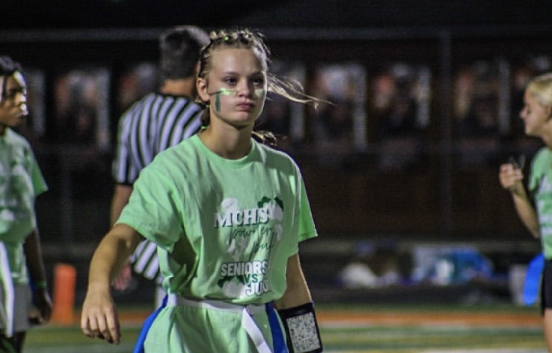 Senior Mason Carr (as a junior) lines up to receive the ball in last year's powder puff game.  The juniors won in 2023, 19-12. 