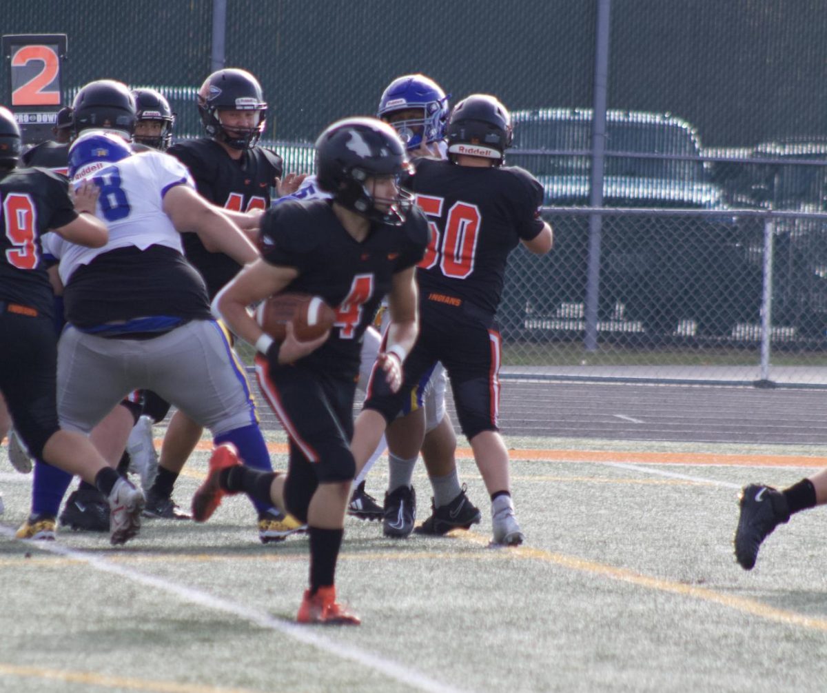 Freshman Bryce Babecki takes the ball into the end zone in a game against Joliet Central. 