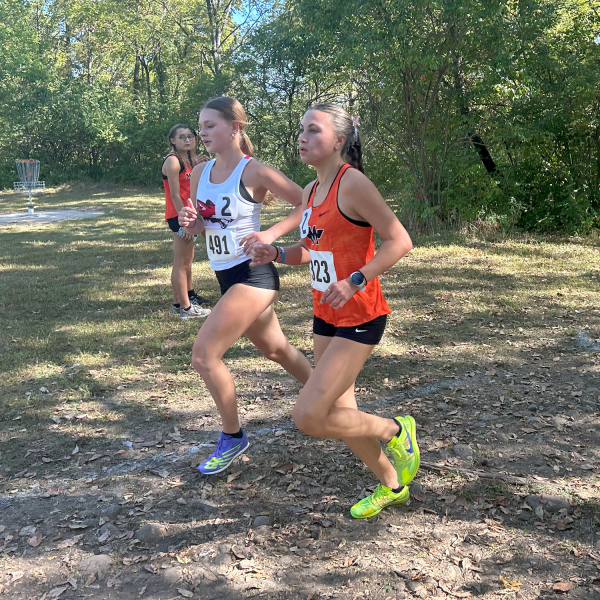 Sophomore Natalie Nahs runs in flight 2 at the Minooka Invite on Sept. 21.  She finished second.