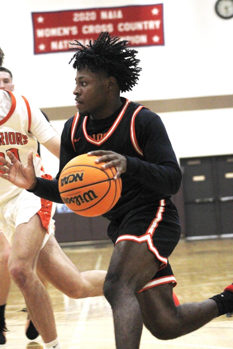 Senior Jeremiah Brown drives to the basket against Lincoln-Way West in the WJOL Tournament on Nov. 25.